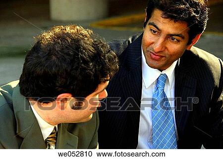 2 young adult male business men sitting together having discussion outdoors View Large Photo Image Stock Image - 2 young adult male business men sitting together having discussion outdoors. Fotosearch