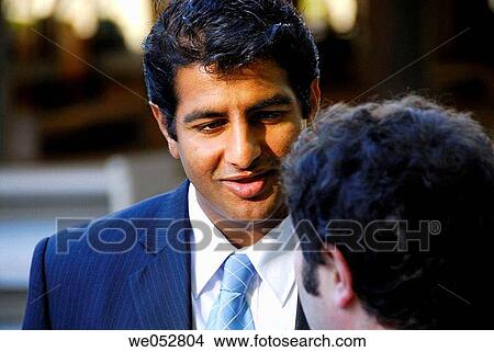 2 young male business men having discussion View Large Photo Image Picture - 2 young male business men having discussion. Fotosearch