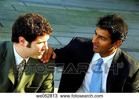 2 young male business men having discussion outdoors View Large Photo Image Stock Image - 2 young male business men having discussion outdoors. Fotosearch