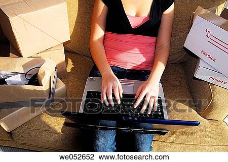 20 yr old woman home shopping on laptop computer View Large Photo Image Stock Image - 20 yr old woman home shopping on laptop computer. Fotosearch