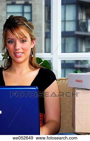 20 yr old woman home shopping on laptop computer View Large Photo Image Stock Photo - 20 yr old woman home shopping on laptop computer. Fotosearch