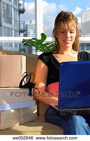 20 yr old woman home shopping on laptop computer View Large Photo Image Stock Photograph - 20 yr old woman home shopping on laptop computer. Fotosearch