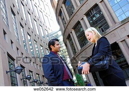 35 yr old ethnic business man standing with caucasian 25 yr old woman opening briefcase View Large Photo Image Stock Image - 35 yr old ethnic business man standing with caucasian 25 yr old woman opening briefcase. Fotosearch