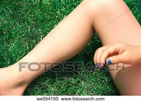 A five year old girls leg and hand in the grass View Large Photo Image Stock Image - A five year old girls leg and hand in the grass. Fotosearch