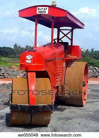 Stock Photo - A road roller at roadside where roadmaking process is in progrss. Kochi (Cochin), Kerla, India.. Fotosearch