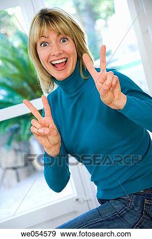 Stock Photo - achievement, blond, at-home, 30's. Fotosearch