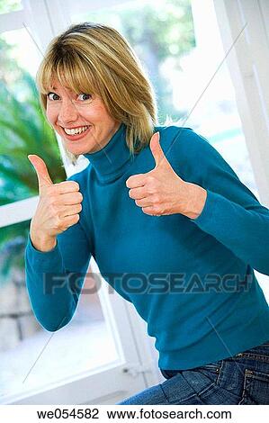 achievement, blond, at-home, approval, 30's View Large Photo Image Stock Image - achievement, blond, at-home, approval, 30's. Fotosearch