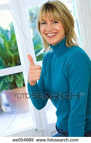 achievement, blond, at-home, approval, 30's View Large Photo Image Stock Photo - achievement, blond, at-home, approval, 30's. Fotosearch