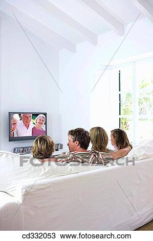 Stock Image - addiction, back view, at-home, 30's. Fotosearch
