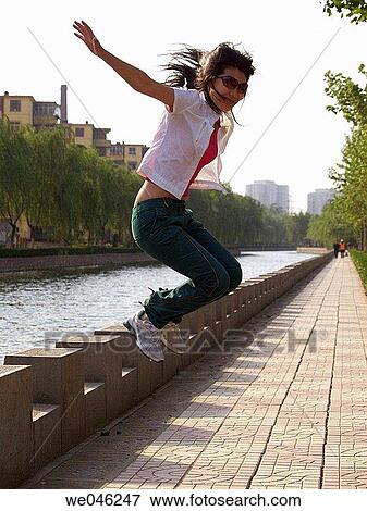 adolescence, Arms raised, agility, agile, 20 View Large Photo Image Stock Photo - adolescence, Arms raised, agility, agile, 20. Fotosearch