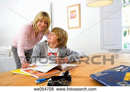 Stock Photo - aid, boy, book, at-home, 30's. Fotosearch