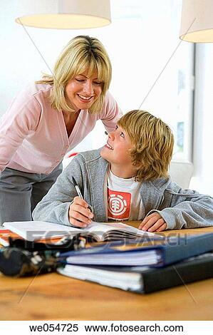 Stock Photography - aid, boy, book, at-home, 30's. Fotosearch