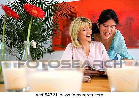 amusement, browsing, browse, at-home, 30's View Large Photo Image Stock Image - amusement, browsing, browse, at-home, 30's. Fotosearch