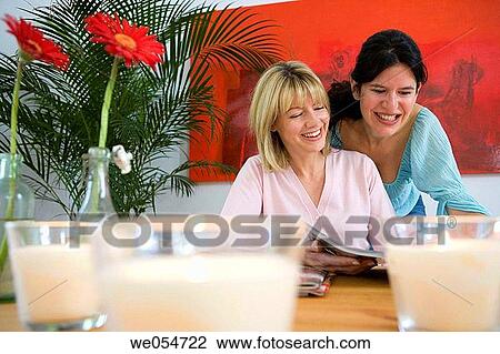 amusement, browsing, browse, at-home, 30's View Large Photo Image Stock Image - amusement, browsing, browse, at-home, 30's. Fotosearch