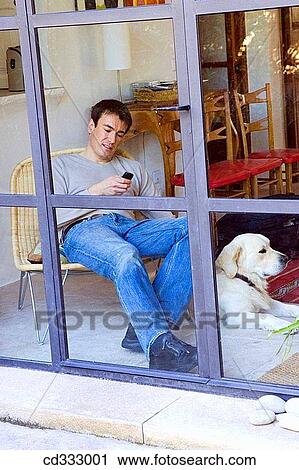 Stock Image - animal, calm, at-home, 30's. Fotosearch