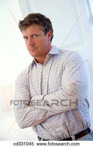 Arms crossed, Bad mood, at-home, arms folded, angry View Large Photo Image Stock Photography - Arms crossed, Bad mood, at-home, arms folded, angry. Fotosearch