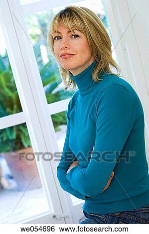 Arms crossed, blond, at-home, arms folded, angry View Large Photo Image Stock Photograph - Arms crossed, blond, at-home, arms folded, angry. Fotosearch