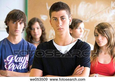 Arms crossed, boy, black hair, arms folded, adolescence View Large Photo Image Stock Photo - Arms crossed, boy, black hair, arms folded, adolescence. Fotosearch