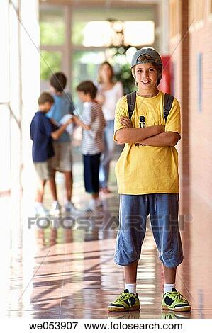 Stock Photo - arms folded, child, cap, boy, Arms crossed. Fotosearch