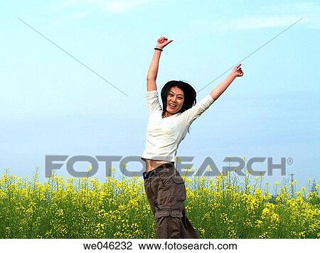 Asian, contemporary, brunette, Arms raised View Large Photo Image Stock Image - Asian, contemporary, brunette, Arms raised. Fotosearch