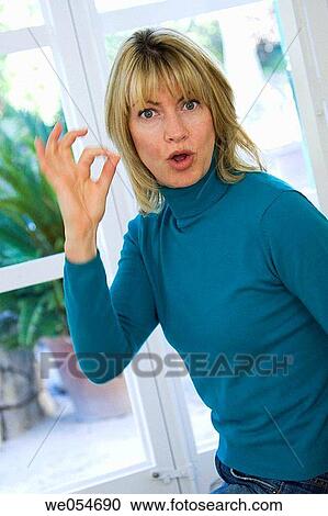 Stock Image - at-home, blond, approval. Fotosearch