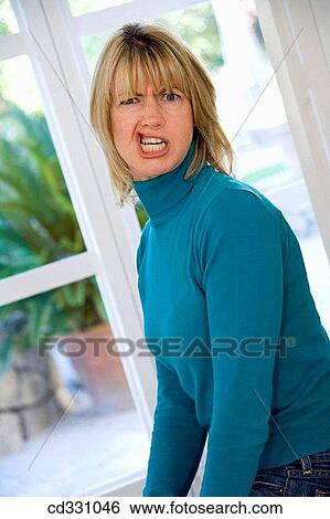 at-home, blond, Bad mood, angry View Large Photo Image Stock Photograph - at-home, blond, Bad mood, angry. Fotosearch