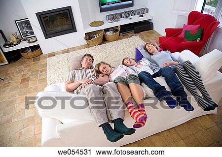 Stock Image - at-home, boy, barefoot, 30's. Fotosearch