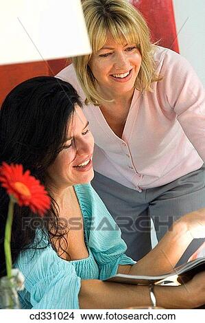 at-home, browsing, browse, 30's View Large Photo Image Picture - at-home, browsing, browse, 30's. Fotosearch