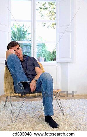 Stock Photo - at-home, calm, absorbed. Fotosearch