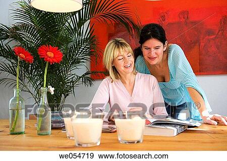Stock Photo - at-home, candle, browsing, browse, 30's. Fotosearch