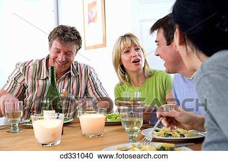 Stock Image - at-home, chat, 30's. Fotosearch