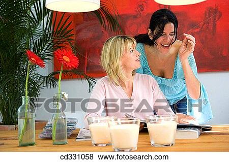 Stock Photo - at-home, chat, candle, 30's. Fotosearch