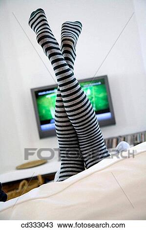 Stock Image - at-home, contemporary, barefoot, amusing. Fotosearch