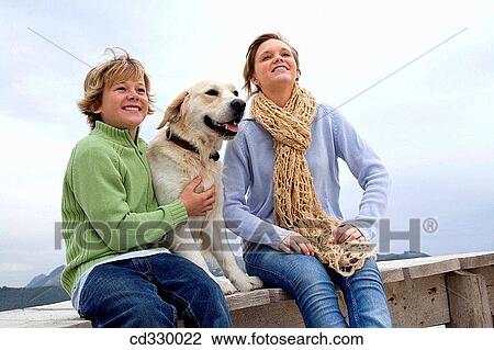 Stock Image - autumn, calm, brother, boy, animal. Fotosearch