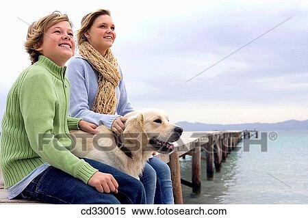 Stock Photography - autumn, calm, brother, boy, animal. Fotosearch