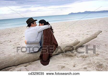 Stock Photography - baby boomer, Best friend, beach, back view, amusement. Fotosearch