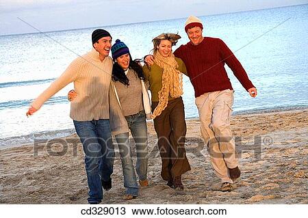Stock Image - baby boomer, blond, beach, amusement. Fotosearch