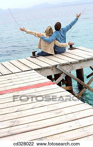 Stock Image - back view, bonding, bond, Arms open. Fotosearch