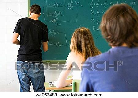 Stock Photo - back view, boy, board, blackboard, adolescence. Fotosearch