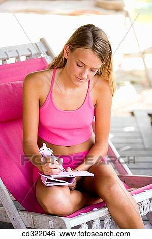 Stock Photograph - Ball-point pen, contemporary, brunette, adolescence. Fotosearch