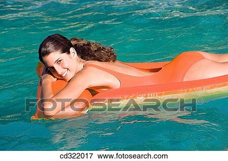 bathing, air mattress, bathe, amusement, air-bed, adolescence View Large Photo Image Stock Photo - bathing, air mattress, bathe, amusement, air-bed, adolescence. Fotosearch