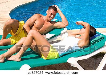 bathing-suit, bonding, bond, beach chair, affection View Large Photo Image Picture - bathing-suit, bonding, bond, beach chair, affection. Fotosearch