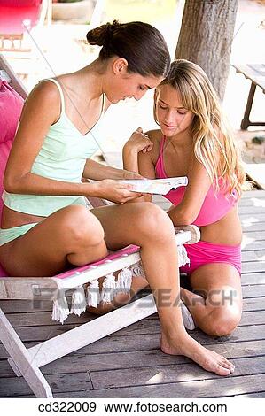 beach chair, brunette, blond, adolescence View Large Photo Image Stock Photo - beach chair, brunette, blond, adolescence. Fotosearch