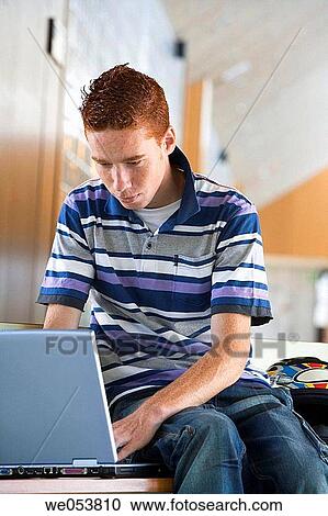 Stock Image - bench, computer, boy, adolescence. Fotosearch