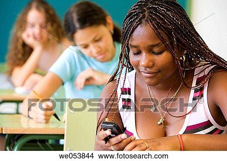 black, communication, classroom, cell phone, adolescence View Large Photo Image Picture - black, communication, classroom, cell phone, adolescence. Fotosearch