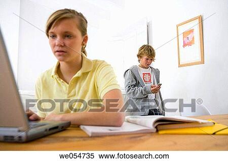 Stock Photography - blond, brother, boy, book, at-home. Fotosearch