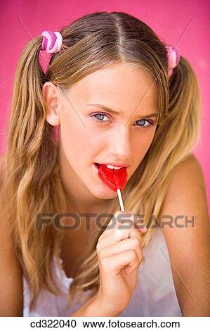 blond, Close-up, candy, blue eyes, adolescence View Large Photo Image Stock Image - blond, Close-up, candy, blue eyes, adolescence. Fotosearch