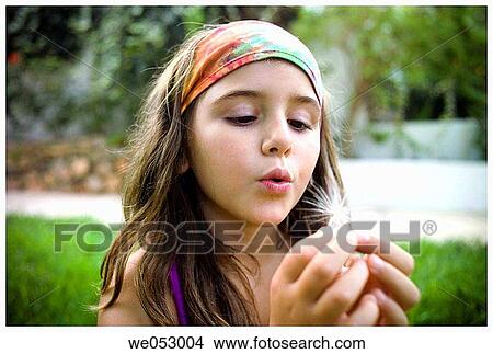 blow, blowing, child, childhood, Close-up View Large Photo Image Picture - blow, blowing, child, childhood, Close-up. Fotosearch