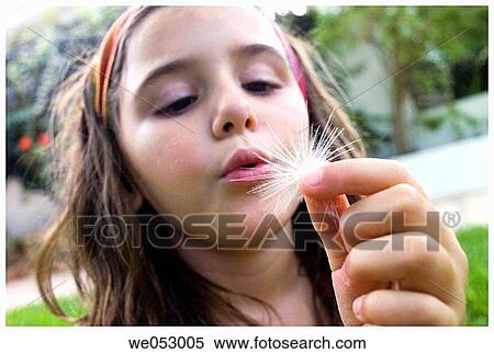 Stock Photography - blow, blowing, child, childhood, Close-up. Fotosearch