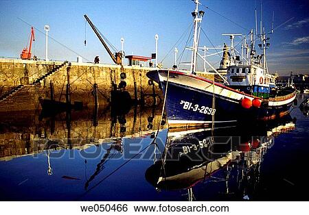Stock Photograph - Blue fishing boat at port of Santurtzi. Biscay, Euskadi, Spain. Fotosearch